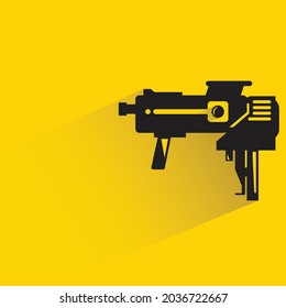 space gun with shadow on yellow background