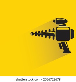 space gun with shadow on yellow background
