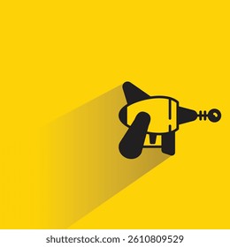 space gun with shadow on yellow background