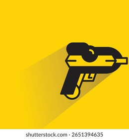 space gun with shadow on yellow background