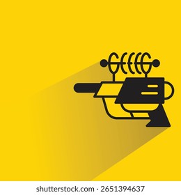 space gun with shadow on yellow background