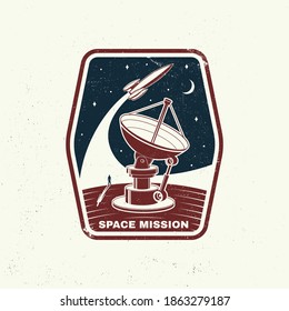 Space mission logo, badge, shirt, t, design, print. Vector. Concept for shirt, print, stamp, overlay or template. Vintage typography design with space rocket, satellite dishes and moon silhouette.