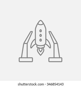 Space shuttle on a take-off area line icon for web, mobile and infographics. Vector dark grey icon isolated on light grey background.