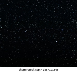 Space Stars Background. Vector Illustration of The Night Sky. Glitter texture. Abstract particles. Sparkle glitter background. Vector illustration. Blue lights.