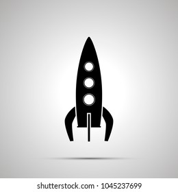 Spaceship silhouette, simple black icon with shadow