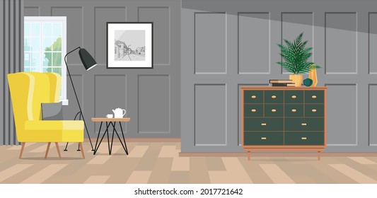 A spacious room with gray classic paneling and a bright yellow armchair by the window.