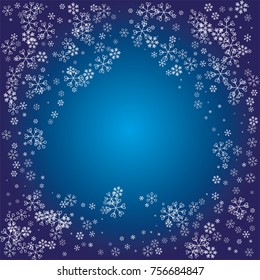 Spades shaped Christmas frame or border with white random scatter falling snowflakes on a navy blue background.