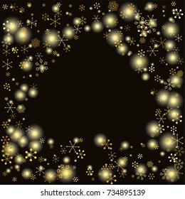 Spades shaped frame or border Christmas background with random scatter falling gold snowflakes and yellow blurred lights isolated on black.