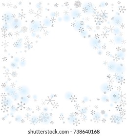 Spades shaped frame or border Christmas background with random scatter falling silver snowflakes and blue blurred dots isolated on white.