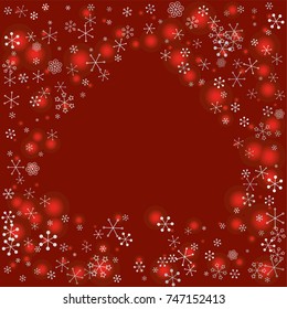 Spades shaped frame or border Christmas background with random scatter falling silver snowflakes and red blurred lights on a burgundy background.