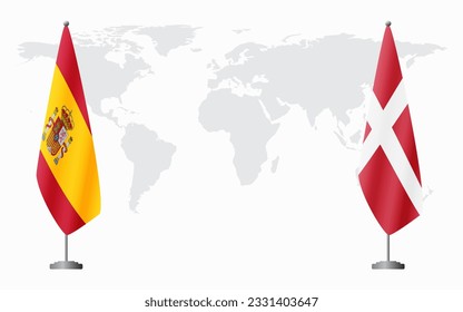 Spain and Denmark flags for official meeting against background of world map.