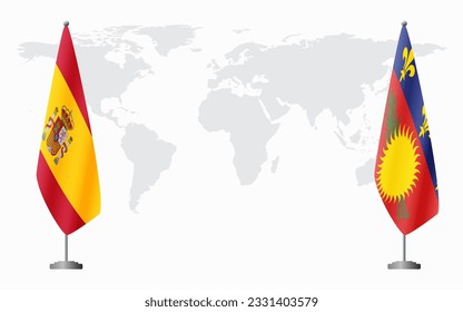 Spain and Guadeloupe flags for official meeting against background of world map.