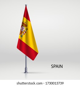 Spain hanging flag on flagpole