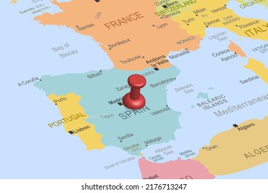Spain with red fastener pushpin on europe map, close up Spain, pinned destination, travel idea, colorful map with location icon, vacation and road trip concept, top view