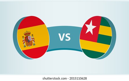 Spain versus Togo, team sports competition concept. Round flag of countries.