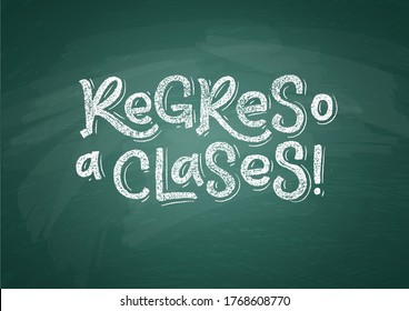 Spanish Back to School text drawing by white chalk on Green Chalkboard. Education vector illustration banner. Translation: Welcome Back to School.