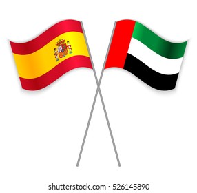 Spanish and Emirati crossed flags. Spain combined with United Arab Emirates isolated on white. Language learning, international business or travel concept.