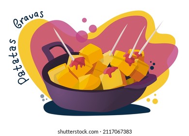 Spanish food patatas bravas in iron bowl