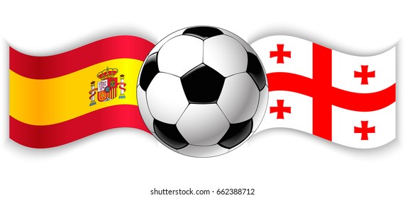 Spanish and Georgian wavy flags with football ball. Spain combined with Georgia isolated on white. Football match or international sport competition concept.