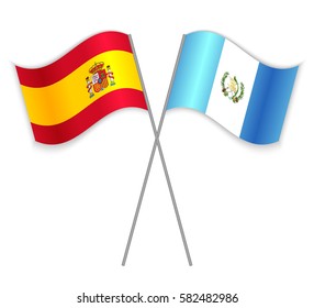 Spanish and Guatemalan crossed flags. Spain combined with Guatemala isolated on white. Language learning, international business or travel concept.