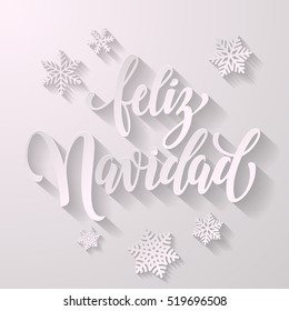 Spanish Merry Christmas Feliz Navidad text for greeting with snowflakes and frosty white lettering with shadow on white background. Vector paper cut design