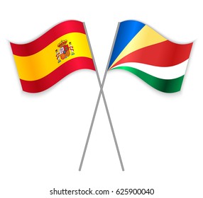 Spanish and Seychellois crossed flags. Spain combined with Seychelles isolated on white. Language learning, international business or travel concept.