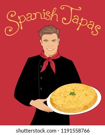 Spanish Tapas. Handsome Spanish chef holding a plate of typical Spanish potato omelette. Handwritten text.