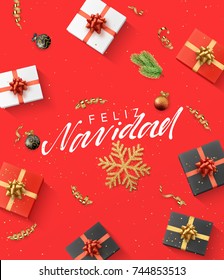 Spanish text Feliz Navidad. Christmas composition. gift, confetti, golden snowflake and balls, Xmas tree branch.