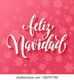 Spanish text for Merry Christmas greeting. Feliz Navidad card with calligraphic lettering design on pink snow background with snowflakes pattern