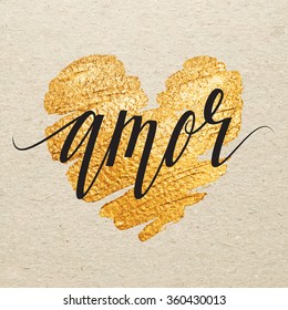 Spanish Valentines day card. Amor calligraphy lettering with gold paint heart on craft background. Hand drawn letters.