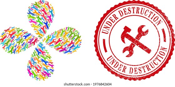 Spanner tool multicolored rotation twist, and red round UNDER DESTRUCTION grunge stamp. Spanner tool symbol inside round stamp imitation. Object burst created from scattered spanner tool items.