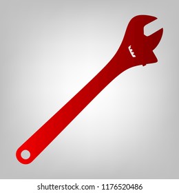 Spanner wrench sign illustration. Vector. Vertically divided icon with colors from reddish gradient in gray background with light in center.
