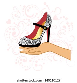Sparkle shoe in hand