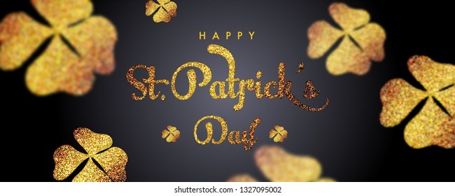 Sparkling calligraphy of St Patrick's Day on black background decorated with glittering clover leaves. Header or banner design.