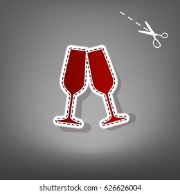 Sparkling champagne glasses. Vector. Red icon with for applique from paper with shadow on gray background with scissors.