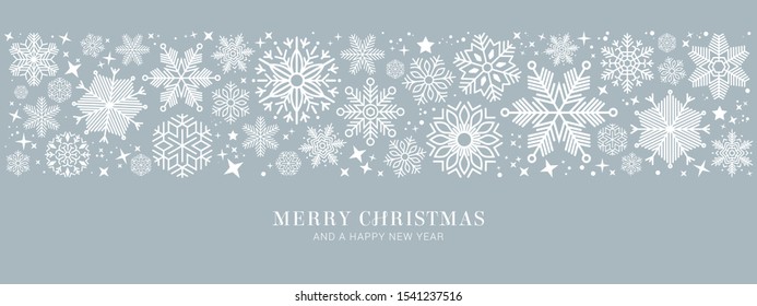 Sparkling Christmas glitter ornaments isolated on Silver background. Silver fiesta border. Festive garland with hanging balls and ribbons. Great for New year party posters, website headers