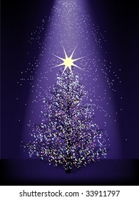 sparkling christmas tree with light beam