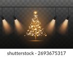 A sparkling Christmas tree on stage with spotlights.