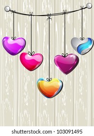 Sparkling colorful heart shapes hanging om wooden background, can be use as flyer, banner, icon, sticker and tag. EPS 10. Vector illustration.