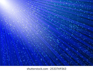 Sparkling glitter and glowing rays with shiny stars. Christmas blue background.