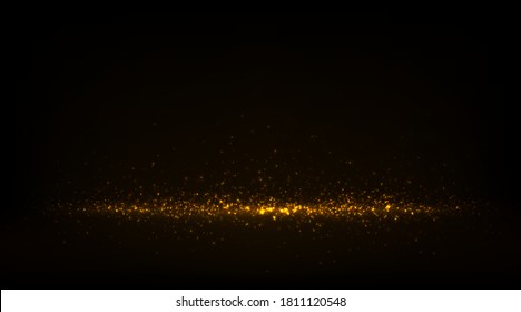 Sparkling golden dust effect. Abstract luxury background with shiny glitters and glowing particles on black.