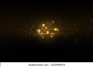 Sparkling golden dust, glowing particles on black. Shiny glittering effect. Abstract glowing light luxury background