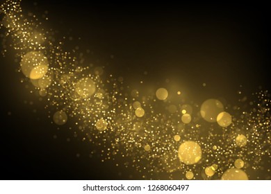 Sparkling golden particles explosion. Glowing bokeh lights abstract background