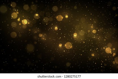 Sparkling golden particles explosion on dark background