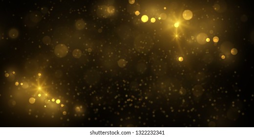 Sparkling golden particles explosion on dark. Glowing light effect abstract magical background.