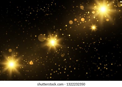 Sparkling golden particles explosion on dark. Glowing light effect abstract magical background.
