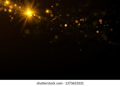 Sparkling golden particles explosion on black background