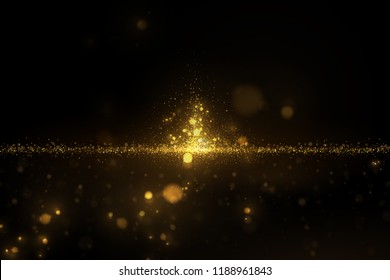 Sparkling golden particles on black. Eps 10 shiny gold glitters abstract luxury background