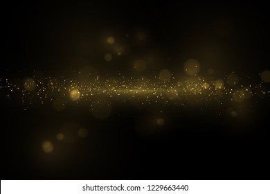 Sparkling golden particles on dark. Abstract luxury background