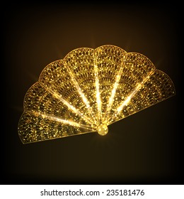 Sparkling golden traditional fan of China on stylish brown background.